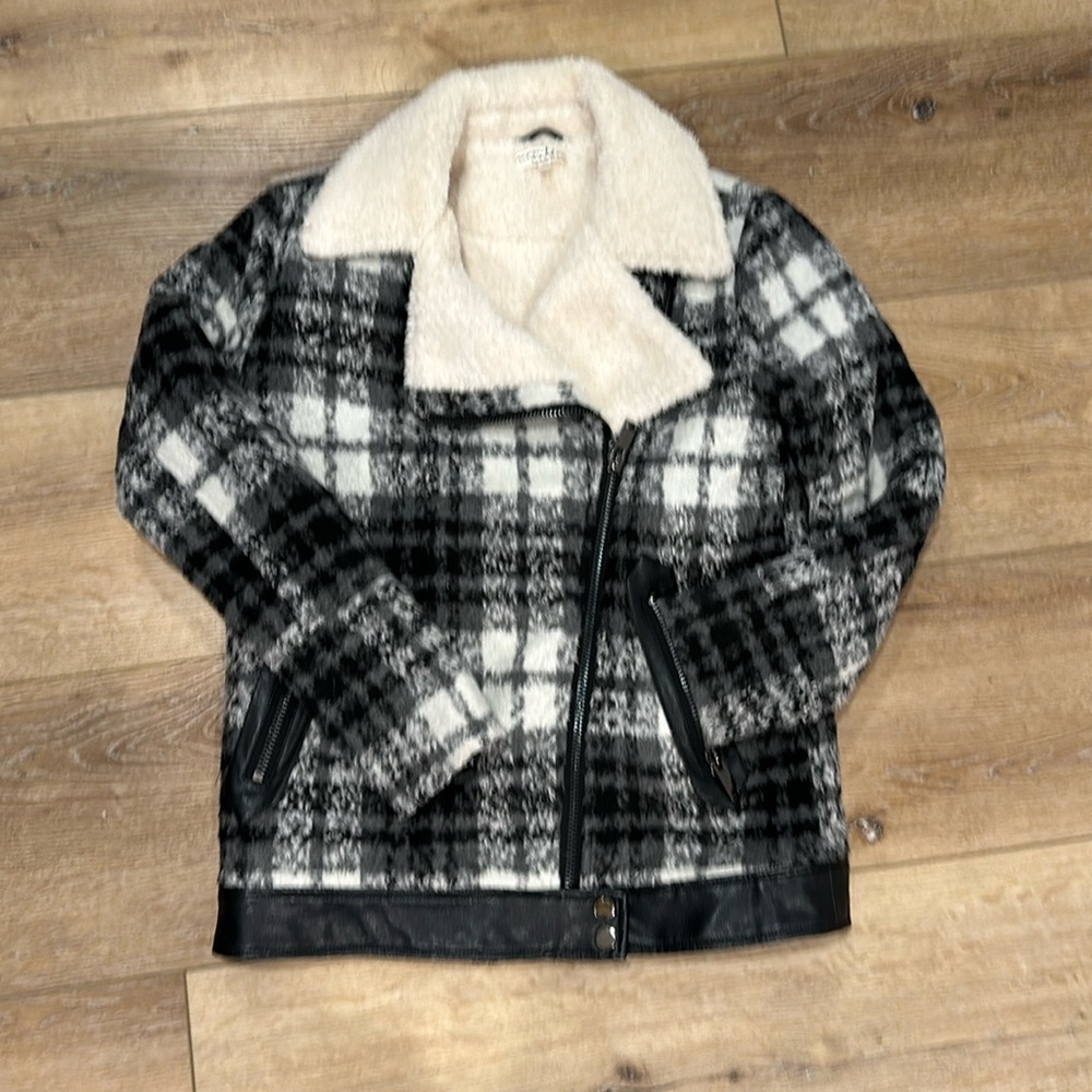Black and white Sherpa day to night moto-style jacket.